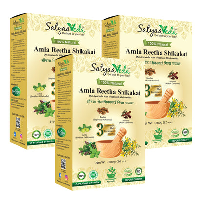 Three boxes of SatyaaVeda Amla Reetha Shikakai on a white background